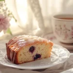 A slice of a delicious plum cake recipe with glaze