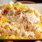 Baked chicken casserole with cheese and vegetables in a dish