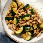 Delicious ground chicken dish with vegetables and herbs served in a bowl